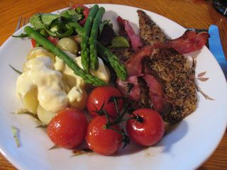 Peppered mackerel with new potatoes in hollandaise sauce, bacon, vine tomatoes, asparagus and beetroot & red pepper salad