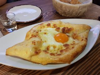 2019-07-17 Khachapuri (Adjaruli) served at Georgian Restaurant in Kyiv