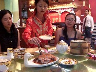 Waitress demonstrating the art of eating Peking Roast Duck - Quanjude Melbourne - VLC snapshot