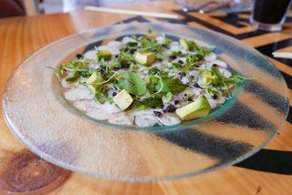 Botija olives are hand-picked and cured naturally with salt, unlike most olives which are harvested before ripe and softened and colored with chemicals. Pulpo al Olivo Rosita Yimura (the mother of Nikkei cuisine) - Octopus, Botija olive-mayo, avocado $15