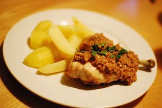 grilled chicken with sauce made from fresh walnuts and pomegranate syrup. apparently this is called satsivi in Georgian cuisine