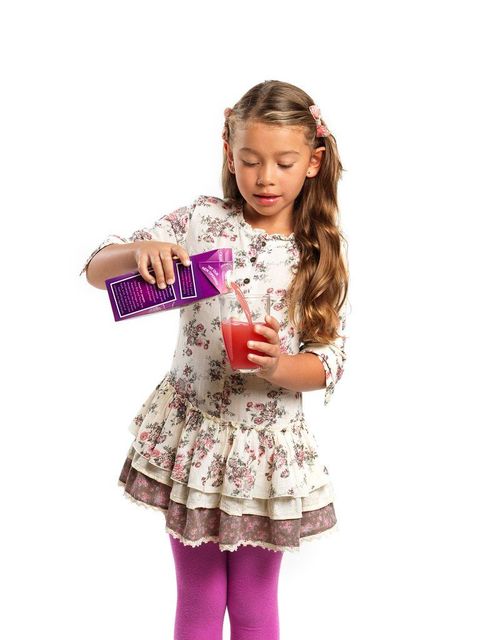 Girl with a Tetra Brik® Aseptic Edge carton package