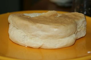 Coco bread on yellow plate