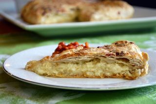 Gibanica single slice with full pie in background