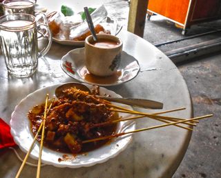 Peanut sauce chicken Satay and Milk tea in Panjang coffee shop